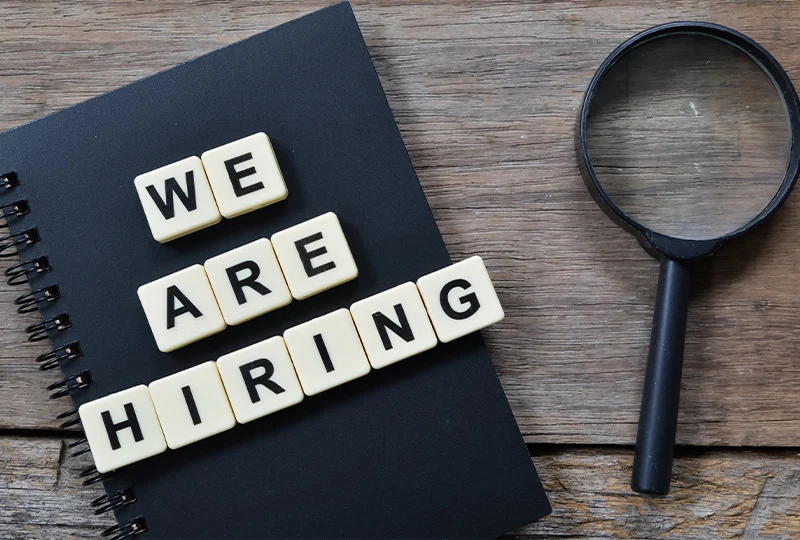 the-recruitment-consultancy-hiring-the-right-people 'We are hiring' letters and magnifying glass