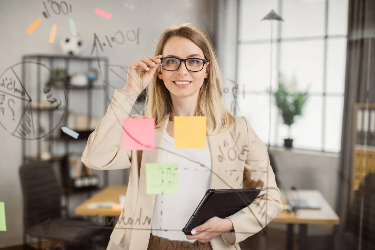 female hr project manager in recruitment wearing glasses
