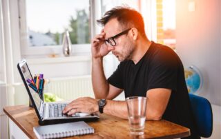 A candidate thinking about writing their CV so it is clear and confident