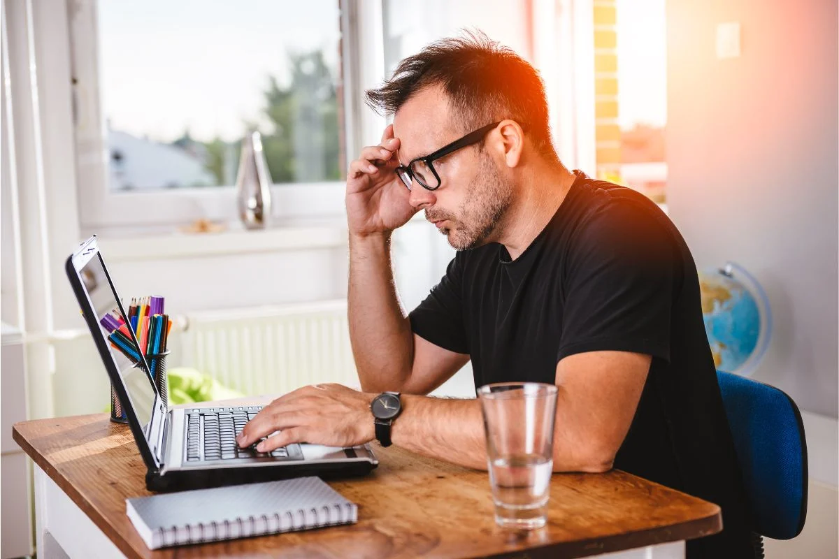 A candidate thinking about writing their CV so it is clear and confident